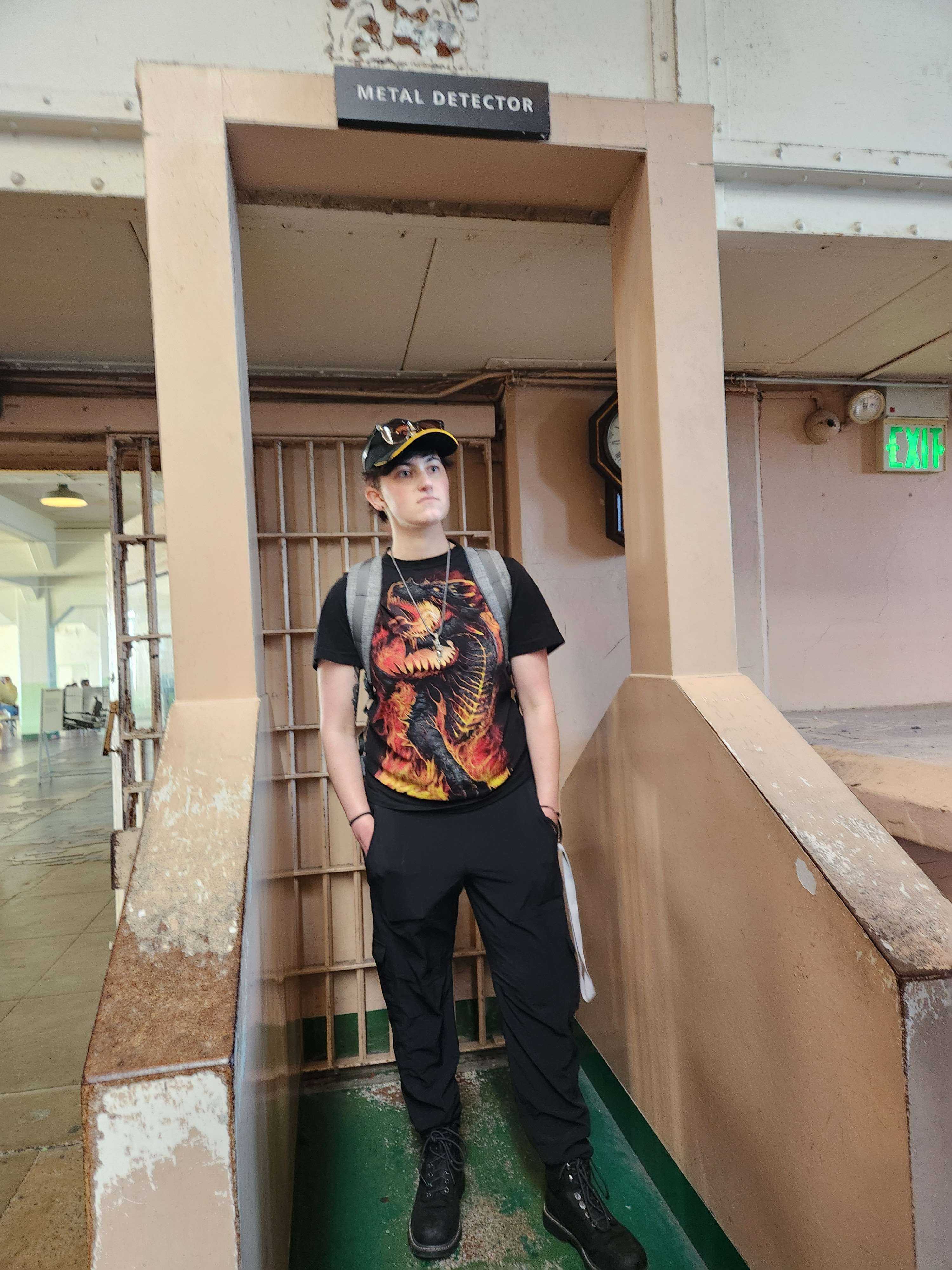 Image of developer Ruby standing in
          front of a metal detector at Alcatraz.